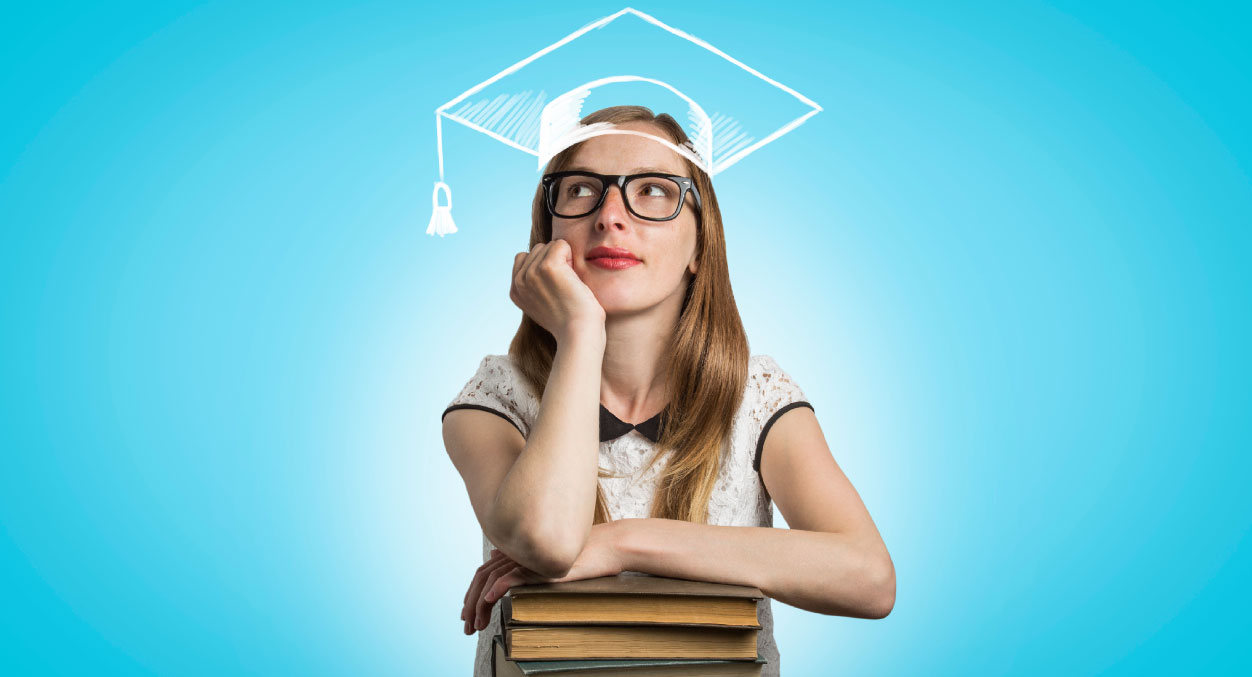 student leaning on stack of books with sketched graduation cap on