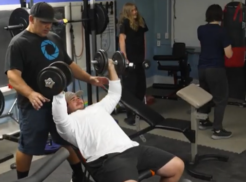 Centennial Strength - image of students weightlifting